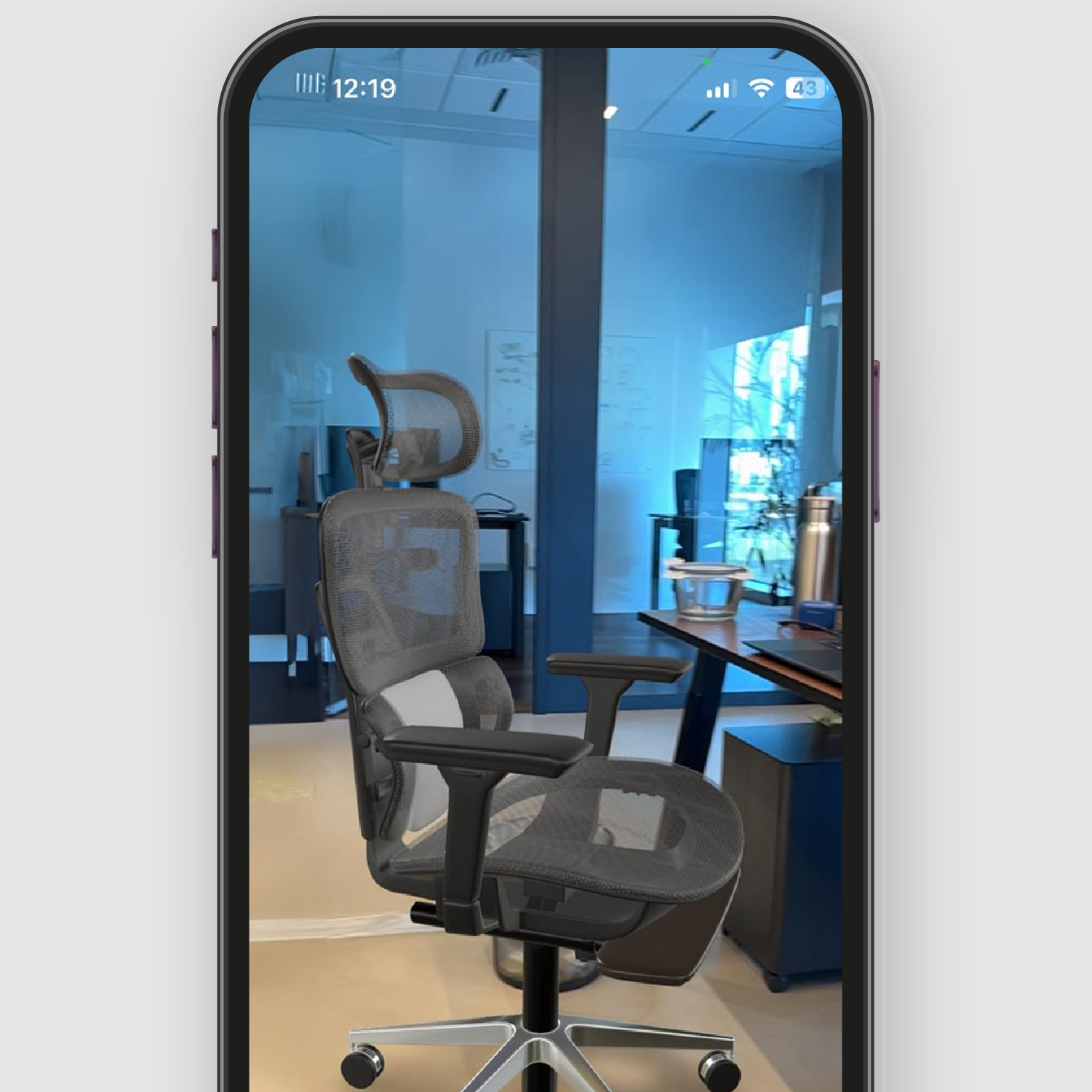 screen capture of a smartphone showing an office chair using augmented reality feature of "show in my room".